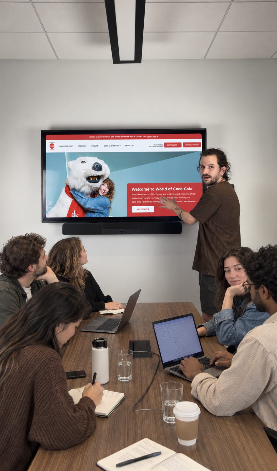 The 2FLY crew reviewing a client preview on the big screen