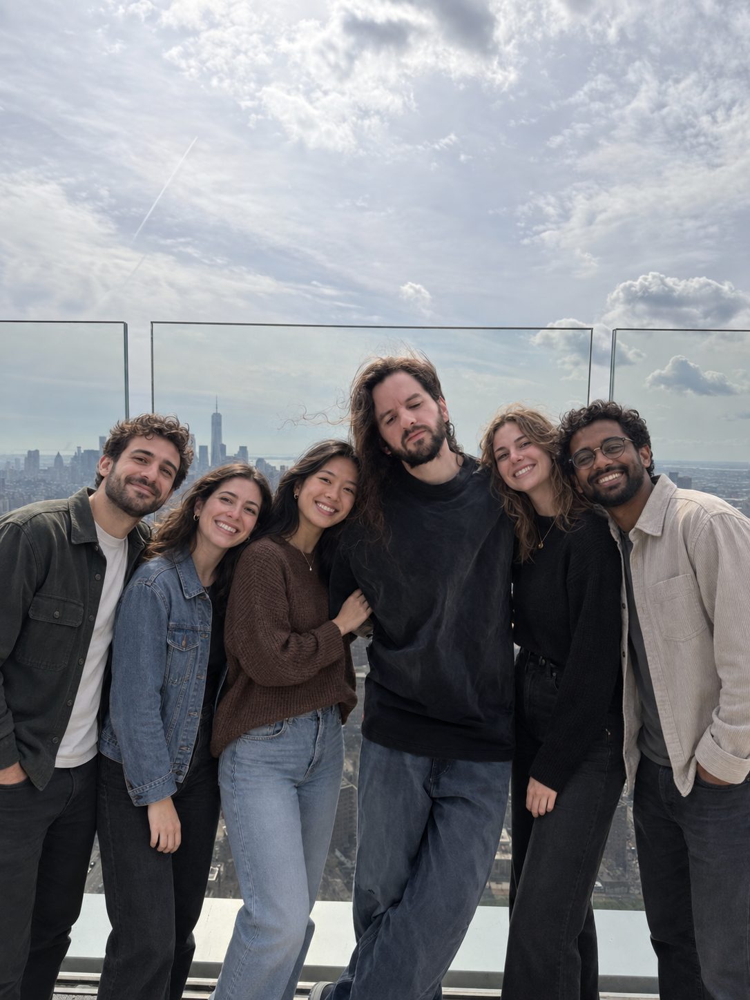 The 2FLY team on a rooftop with the New York skyline behind them